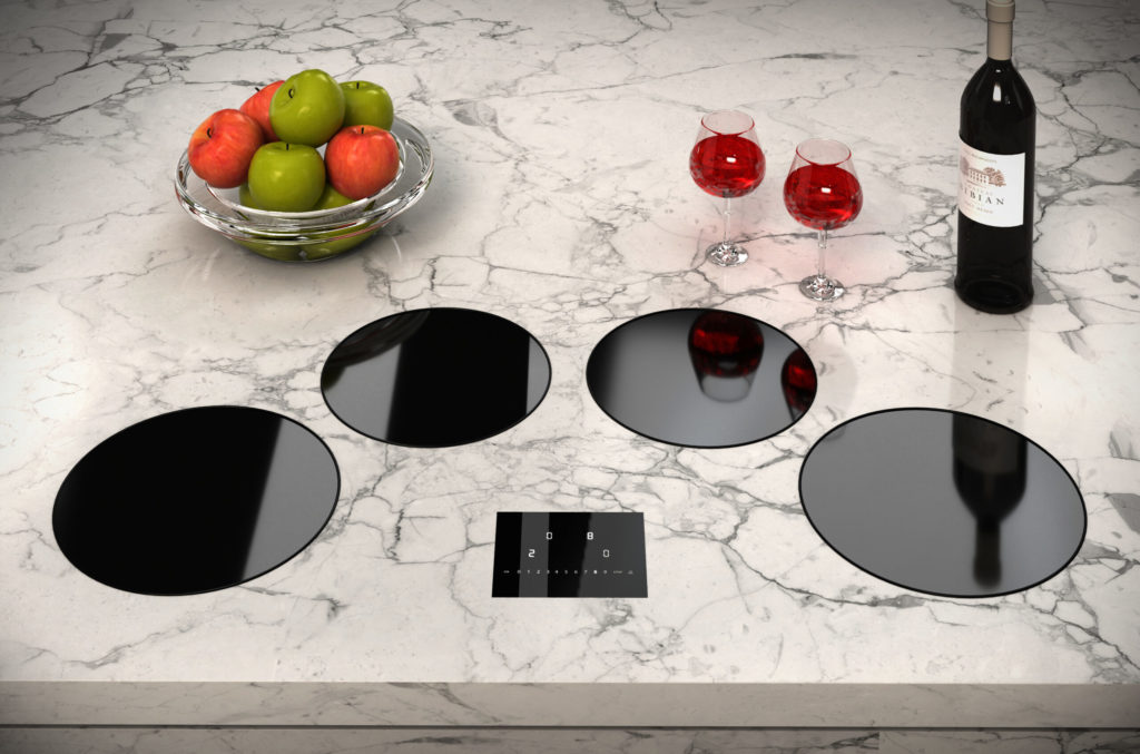 Set of four induction burners on a marble countertop